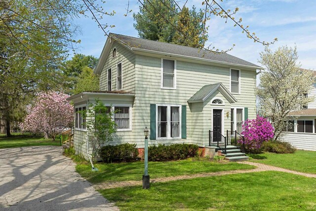 395 Lake St, Green Lake, WI 54941 - colonial home featuring a front lawn
