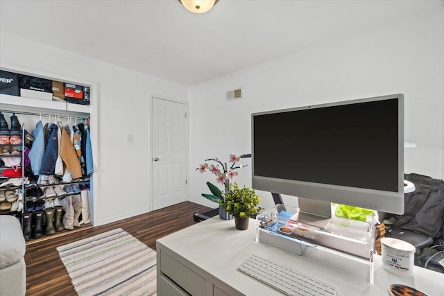 office featuring dark wood-type flooring and baseboards