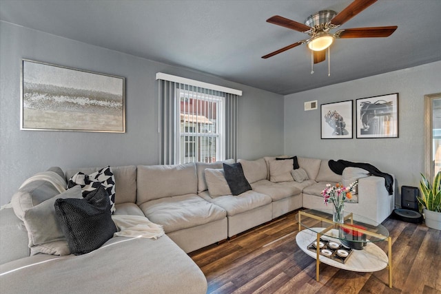 living room with a ceiling fan and wood finished floors