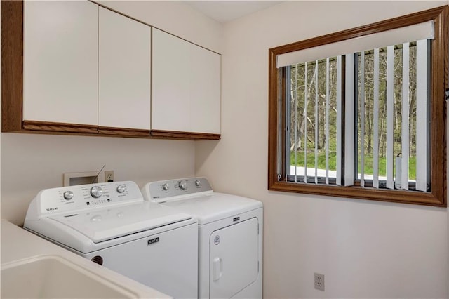 laundry room featuring cabinet space and washer and dryer