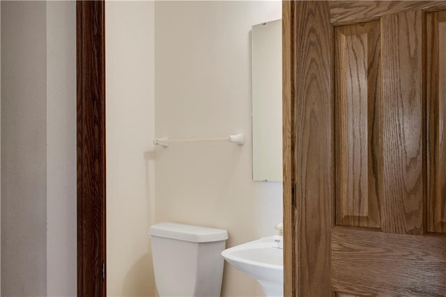 bathroom featuring a sink and toilet
