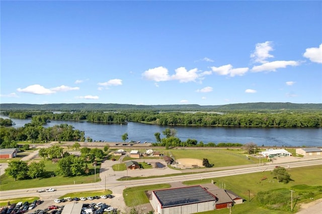 bird's eye view of a nearby body of water and a forest
