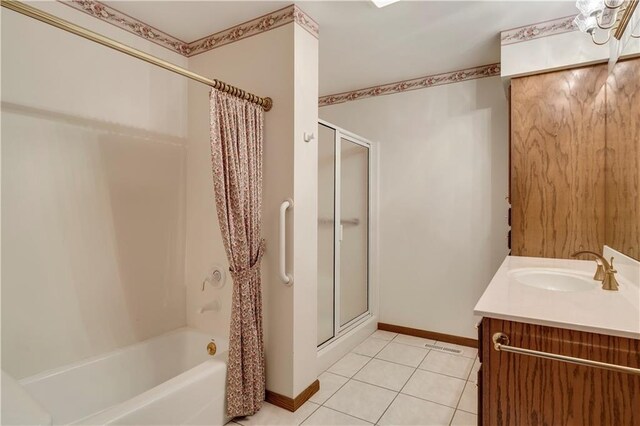 full bath with tile patterned flooring, baseboards, vanity, and shower / tub combo