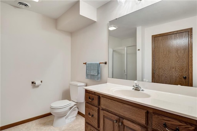 bathroom with toilet, baseboards, vanity, and a shower stall