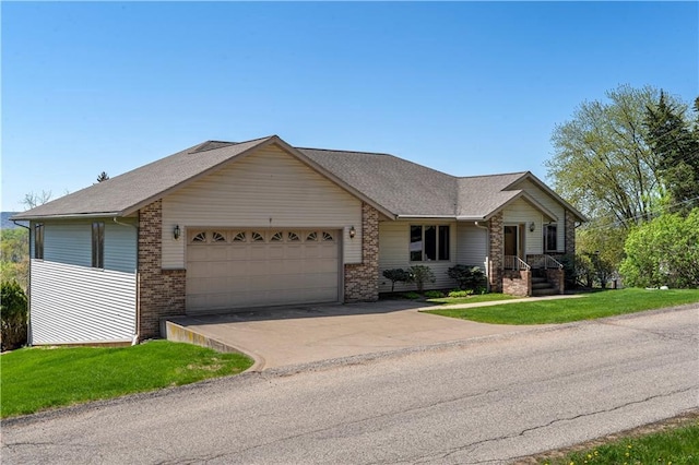 ranch-style home with a garage, concrete driveway, a front lawn, and brick siding