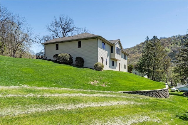 back of house with a yard