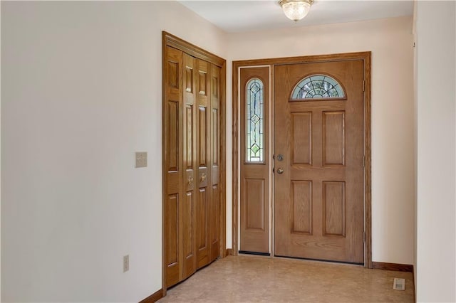 foyer entrance with baseboards