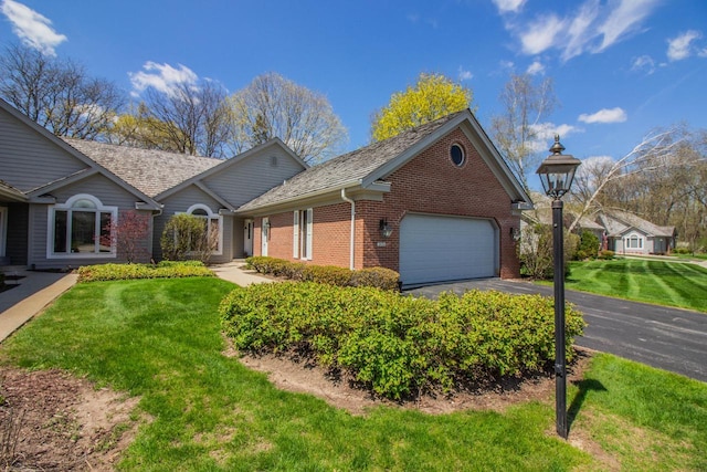 2415 Walnut Grove Ct Unit B, Brookfield, WI 53005 - ranch-style home with a garage, brick siding, driveway, and a front lawn