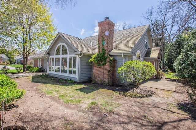 2415 Walnut Grove Ct Unit B, Brookfield, WI 53005 - back of property with a chimney and brick siding