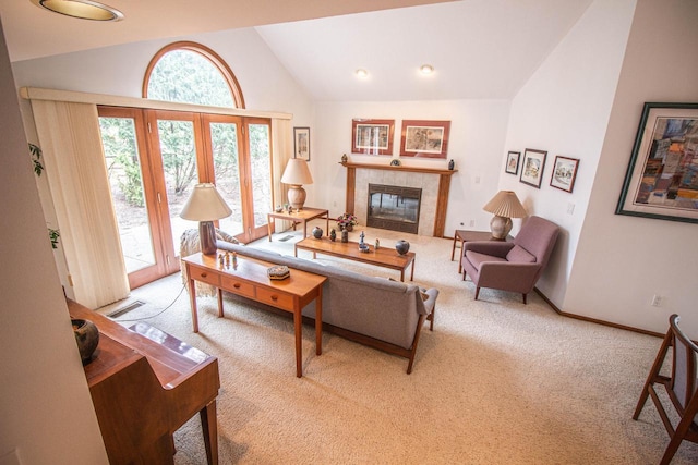 2415 Walnut Grove Ct Unit B, Brookfield, WI 53005 - living room featuring vaulted ceiling, carpet flooring, a tile fireplace, and baseboards