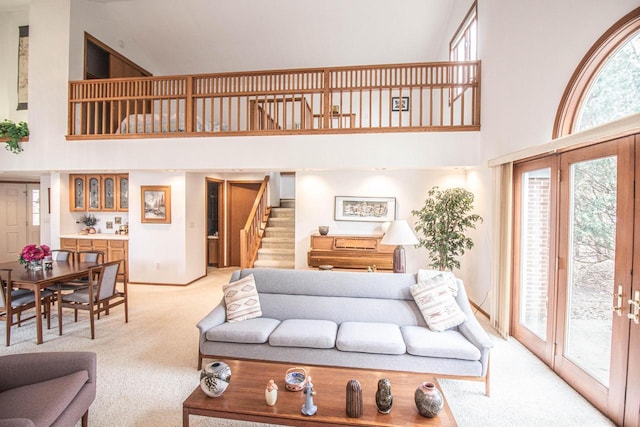 2415 Walnut Grove Ct Unit B, Brookfield, WI 53005 - living area with a high ceiling, light carpet, stairway, and baseboards