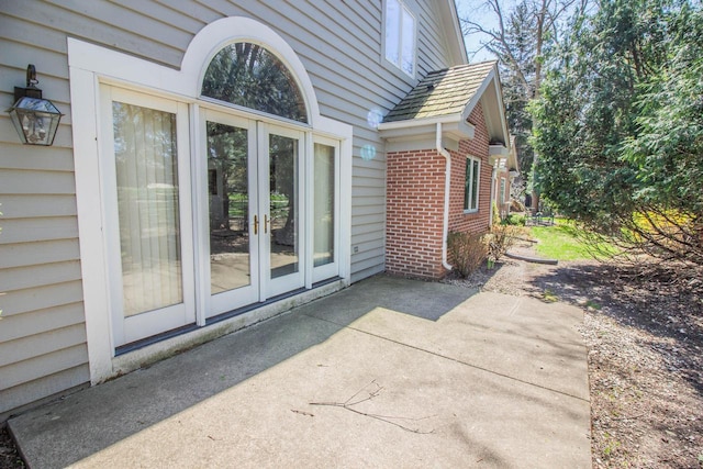 2415 Walnut Grove Ct Unit B, Brookfield, WI 53005 - doorway to property with french doors, brick siding, and a patio