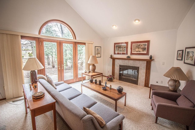 2415 Walnut Grove Ct Unit B, Brookfield, WI 53005 - carpeted living room with high vaulted ceiling, french doors, and a tile fireplace