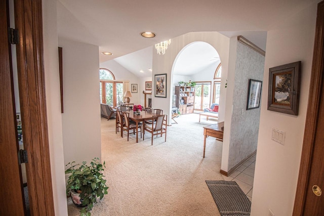 2415 Walnut Grove Ct Unit B, Brookfield, WI 53005 - corridor with light colored carpet, healthy amount of natural light, arched walkways, vaulted ceiling, and baseboards