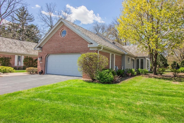 2415 Walnut Grove Ct Unit B, Brookfield, WI 53005 - view of front of property with an attached garage, driveway, brick siding, and a front yard