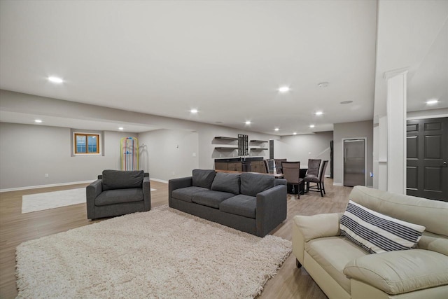 135 Emerald Dr, Mount Pleasant, WI 53406 - living area with light wood finished floors, baseboards, and recessed lighting