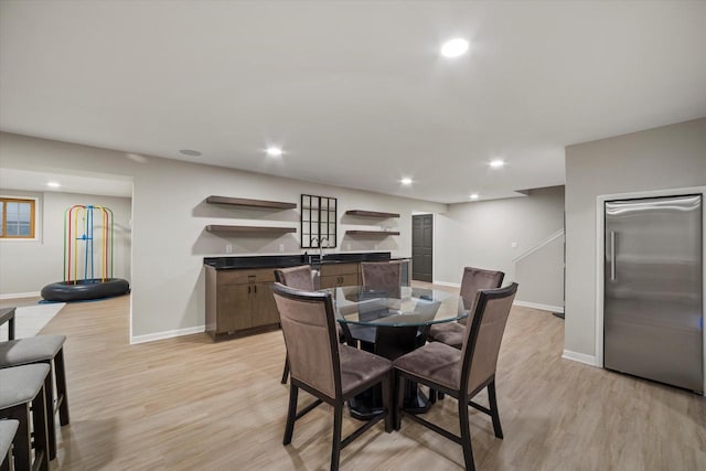 135 Emerald Dr, Mount Pleasant, WI 53406 - dining room featuring baseboards, wet bar, light wood-style floors, and recessed lighting