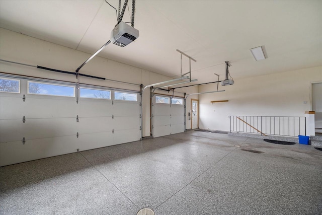135 Emerald Dr, Mount Pleasant, WI 53406 - garage featuring a garage door opener