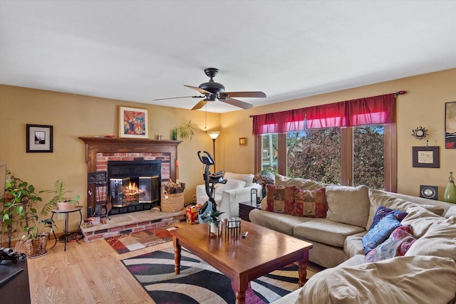 1971 W Bender Rd, Glendale, WI 53209 - living room with wood finished floors, a ceiling fan, and a fireplace