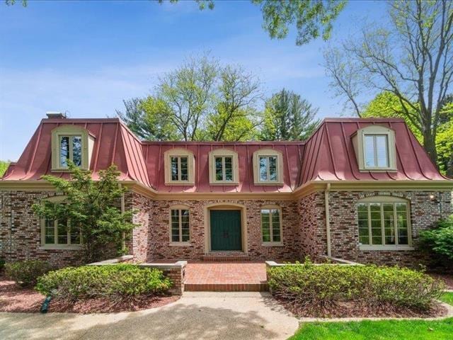 5140 N Kennedy Rd, Milton, WI 53563 - view of front facade with mansard roof and brick siding