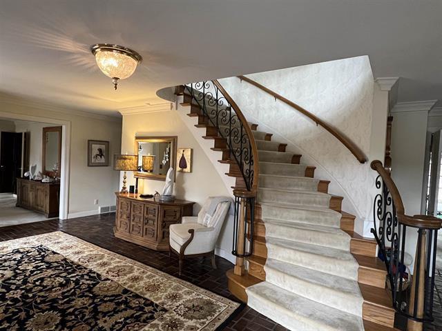 5140 N Kennedy Rd, Milton, WI 53563 - stairway with ornamental molding, brick patterned floors, and baseboards