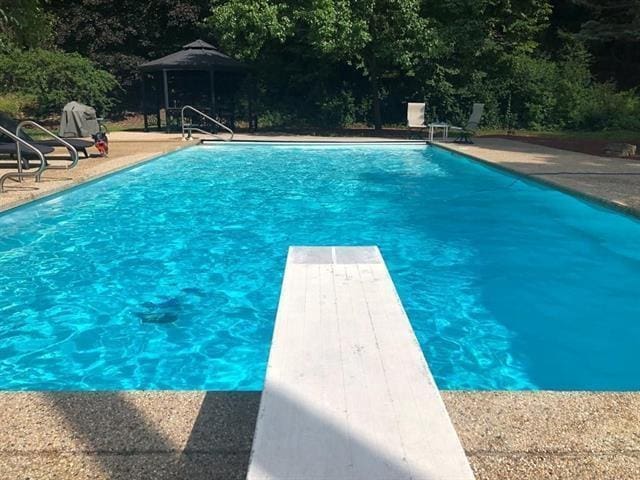5140 N Kennedy Rd, Milton, WI 53563 - swimming pool featuring a diving board, a gazebo, and a patio