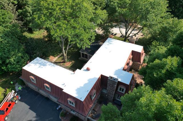 5140 N Kennedy Rd, Milton, WI 53563 - aerial view of property and surrounding area with a heavily wooded area