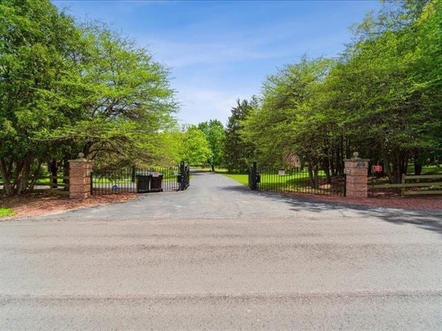 5140 N Kennedy Rd, Milton, WI 53563 - view of home's community with fence and a gate