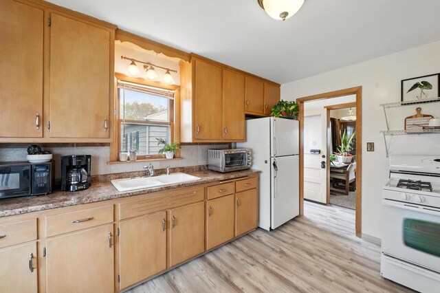 8808 W Burleigh St, Milwaukee, WI 53222 - kitchen featuring white appliances, a sink, and light wood-style floors