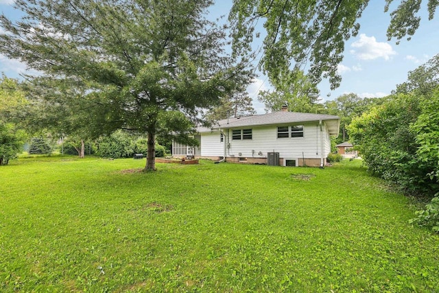6013 Gateway Grn, Monona, WI 53716 - back of house with a lawn, a chimney, and cooling unit