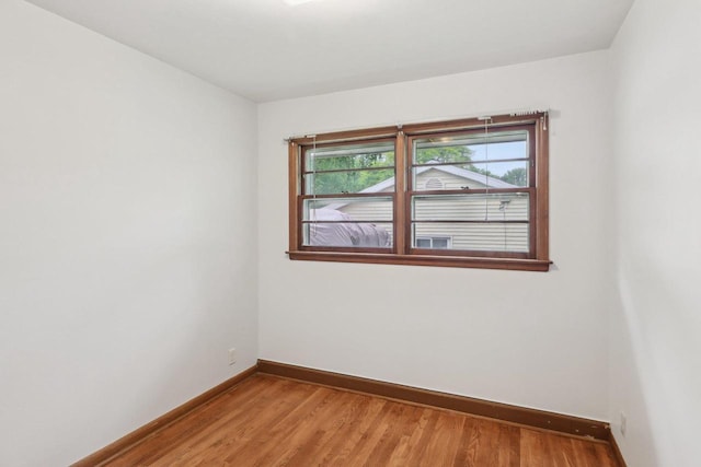 6013 Gateway Grn, Monona, WI 53716 - empty room with baseboards and light wood finished floors