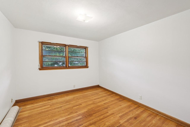 6013 Gateway Grn, Monona, WI 53716 - spare room featuring baseboards and light wood finished floors