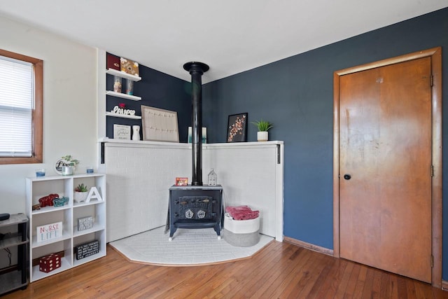 841 Legion Dr, Twin Lakes, WI 53181 - living room with a wood stove and hardwood / wood-style floors