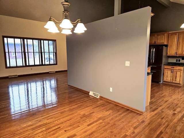 1983 US Highway 2, Florence, WI 54121 - unfurnished room featuring a chandelier, dark wood-style floors, and baseboards