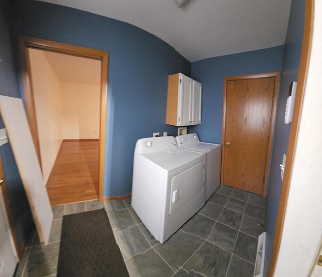1983 US Highway 2, Florence, WI 54121 - laundry area featuring independent washer and dryer, cabinet space, and dark tile patterned flooring