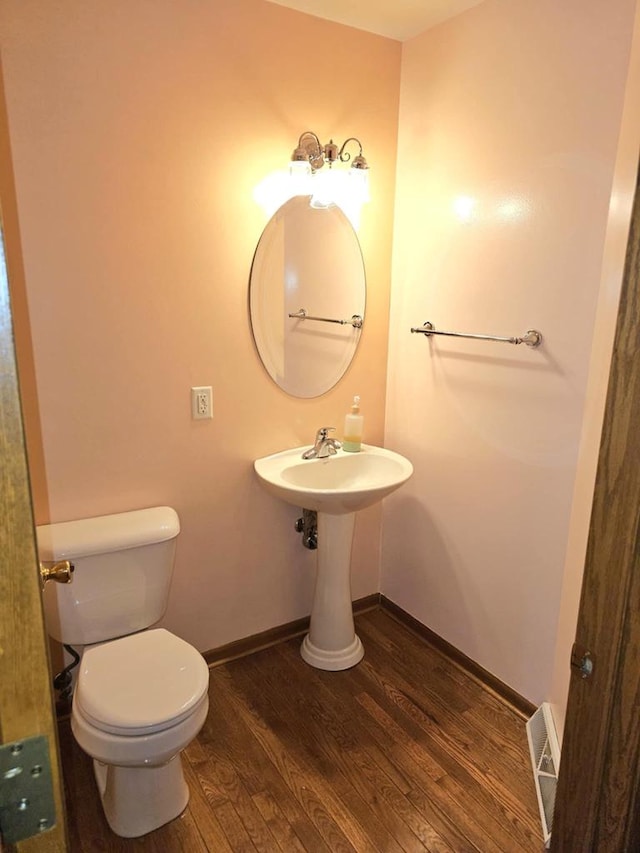 1983 US Highway 2, Florence, WI 54121 - bathroom featuring wood finished floors, toilet, and baseboards