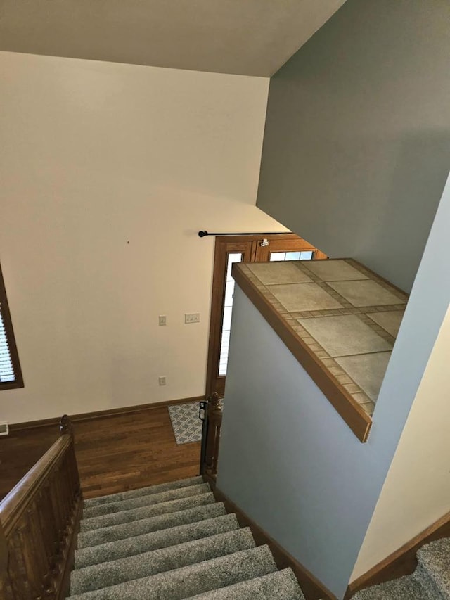 1983 US Highway 2, Florence, WI 54121 - staircase with wood finished floors, baseboards, and healthy amount of natural light
