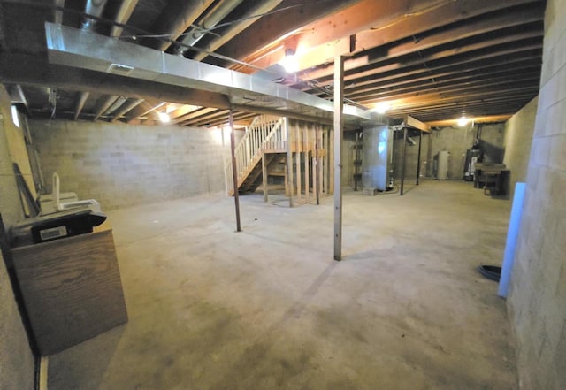 1983 US Highway 2, Florence, WI 54121 - unfinished below grade area with heating unit, stairway, and water heater
