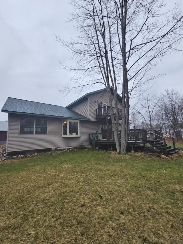 1983 US Highway 2, Florence, WI 54121 - back of house with a wooden deck, a lawn, and roof with shingles
