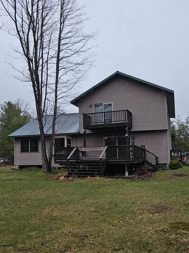 1983 US Highway 2, Florence, WI 54121 - rear view of property with a wooden deck and a yard
