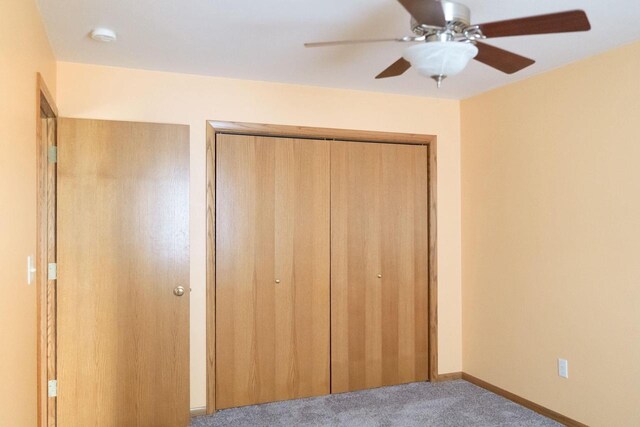 1983 US Highway 2, Florence, WI 54121 - unfurnished bedroom with a closet, carpet floors, a ceiling fan, and baseboards
