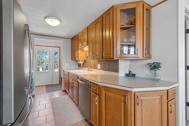 9331 N Marl Lake Rd, Pound, WI 54161 - kitchen featuring stainless steel appliances, a sink, and brown cabinetry