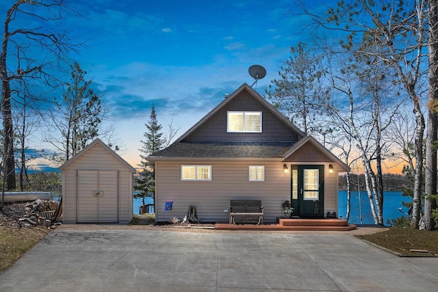 9331 N Marl Lake Rd, Pound, WI 54161 - view of front facade featuring a shed, an outdoor structure, and roof with shingles