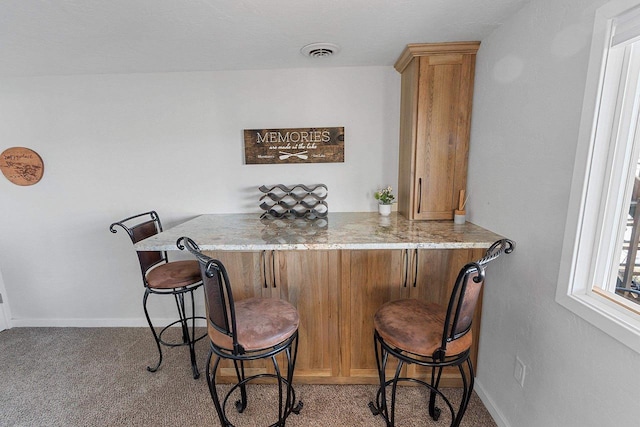 9331 N Marl Lake Rd, Pound, WI 54161 - indoor wet bar with baseboards and light carpet