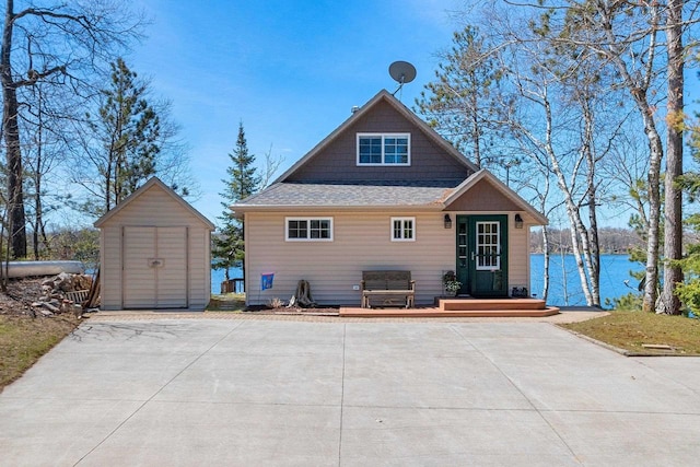 9331 N Marl Lake Rd, Pound, WI 54161 - rear view of house with a storage unit, an outbuilding, a deck, and a shingled roof