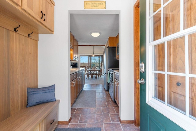 9331 N Marl Lake Rd, Pound, WI 54161 - mudroom featuring stone tile flooring and baseboards
