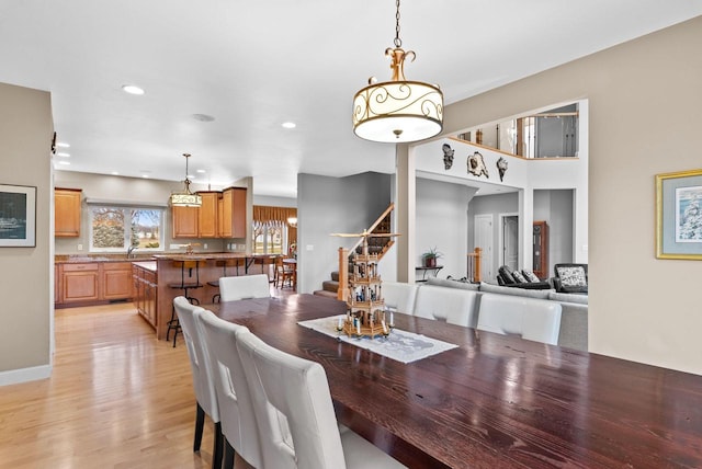 W4344 Carl Dr, Fond Du Lac, WI 54937 - dining area featuring stairway, light wood-style floors, and recessed lighting