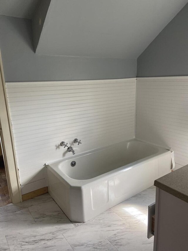 1040 N 1st St, Wisconsin Rapids, WI 54494 - bathroom featuring marble finish flooring and a bath