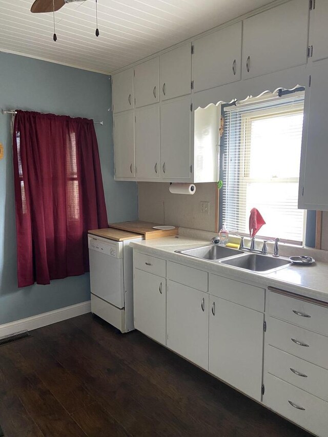 1040 N 1st St, Wisconsin Rapids, WI 54494 - kitchen featuring white dishwasher, dark wood finished floors, light countertops, and a sink