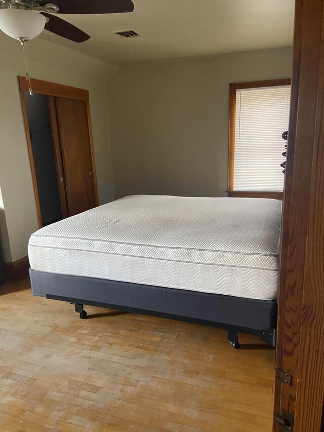1040 N 1st St, Wisconsin Rapids, WI 54494 - bedroom featuring light wood-type flooring, a closet, and a ceiling fan